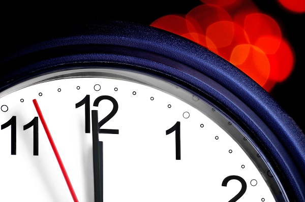Office clock about to show midnight – few seconds to New Year