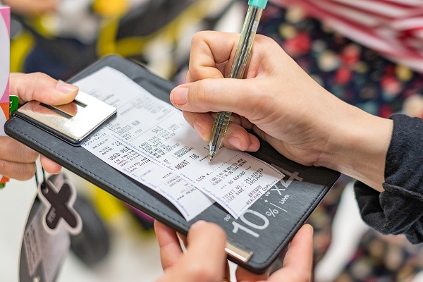 Customer signing on credit card slip shopping mall